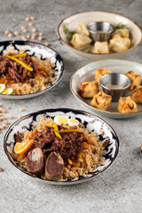Various oriental dishes pilaf and manti on the gray background