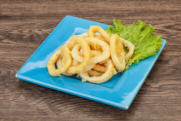 Roasted squid rings with salad