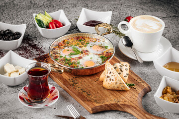 Eastern cuisine breakfast set with shakshuka and various toppings