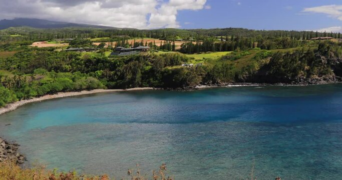 left to right panning motion view of the spectacular Honolua Bay, the primary draw here is perhaps the best snorkelling and some good surfing, Maui, Hawaii, USA