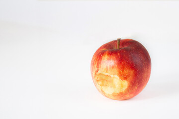 Periodontics. Traces of blood on a bitten off apple on white background with place for text.