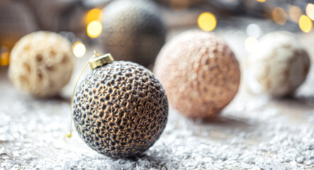 Festive background with Christmas balls and blurred bokeh lights.