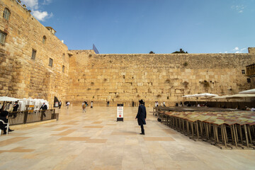 The men's prayer plaza at the Western Wall in Jerusalem, signs on the floor warning people to wear a face mask to protect against the corona virus.