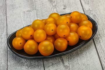 Fresh yellow cherry tomato heap