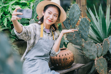 Young Asian woman takes care of the garden
