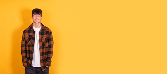teenager boy isolated on yellow background