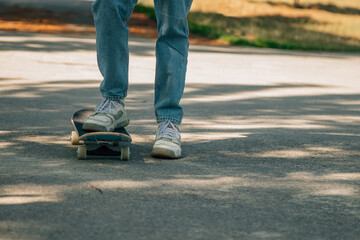 close-up of feet with skateboard