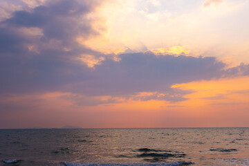 Obraz premium Summer beach with blue sea water and purple sky in twilight period, Sunrise or Sunset over the sea with vintage retro tone.