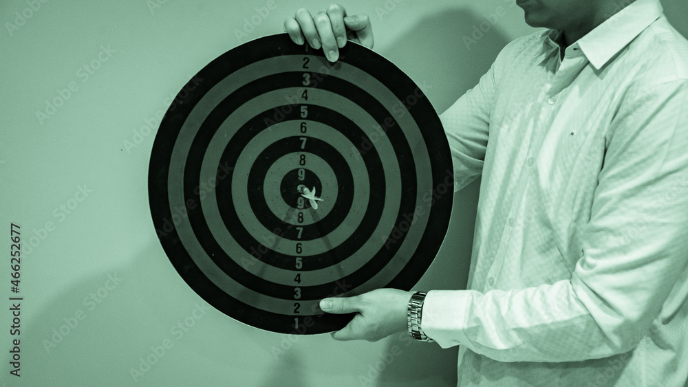 Poster bullseye is a target of business. dart is an opportunity and dartboard is the target and goal. so bo