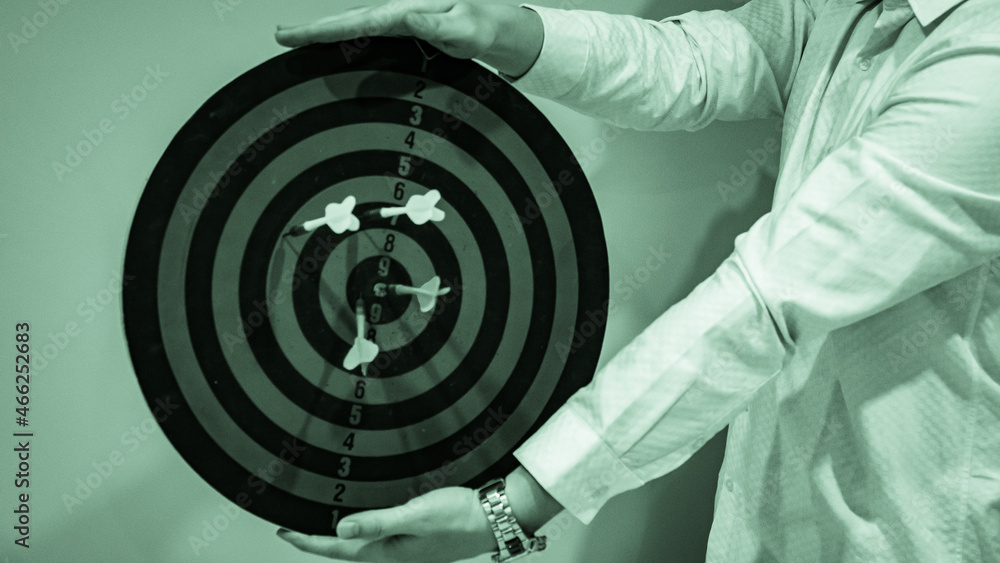 Poster bullseye is a target of business. dart is an opportunity and dartboard is the target and goal. so bo