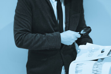 Young business man and digital number of stock market background to represent successful in...