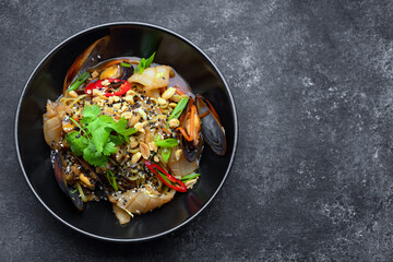 Pasta with seafood herbs sesame seeds and nuts