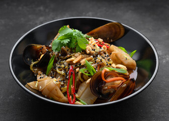 Pasta with seafood herbs sesame seeds and nuts