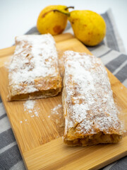 homemade pear pie on wooden tray
