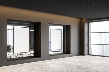 Grey office corridor with two mockups in windows. Corner view.