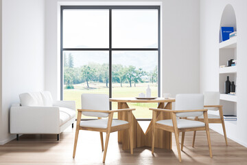 White dining room interior with chairs and sofa near window, art bookshelf
