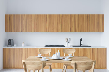 Wooden kitchen set interior with dining table and chairs, shelf with kitchenware