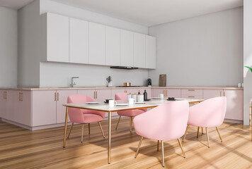 Light kitchen interior with table and chairs on parquet floor