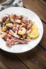seafood mix shrimp, squid, mussel, octopus ready to eat meal snack on the table copy space food background 