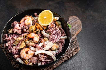 seafood mix shrimp, squid, mussel, octopus ready to eat meal snack on the table copy space food background 