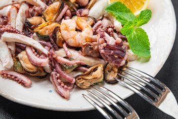seafood mix shrimp, squid, mussel, octopus ready to eat meal snack on the table copy space food background 