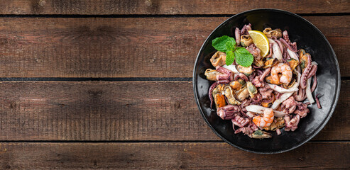 seafood mix shrimp, squid, mussel, octopus ready to eat meal snack on the table copy space food background 