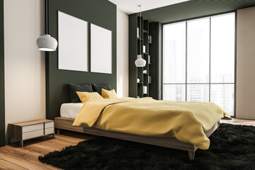Two canvases on wall in dark green and yellow bedroom. Corner view.