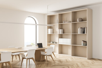 Light conference room interior with furniture, shelf and window with countryside