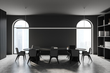 Conference room interior with furniture and windows with city view