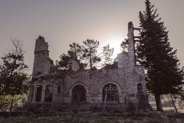 Fototapeta premium Abandoned and demolished old stone building. Selective focus. Copy space.