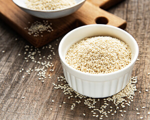 Sesame seeds in a bowl  on a rustic table