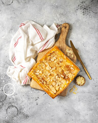 Homemade pie with apples, cinnamon and almonds from puff pastry