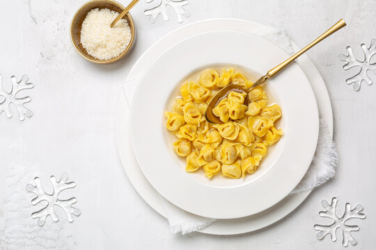Tortellini. Pasta stuffed with a mix of meat, parmigiano cheese and served in capon broth. Traditional Italian Christmas meal.