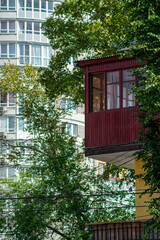 old small house on the background of a new building