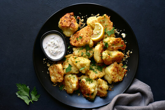Roasted  spicy cauliflower with cheese and garlic crumbs. Top view with copy space.