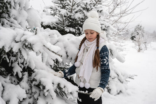 Beautiful girl in white clothes in the winter forest, Ideas for a photo shoot