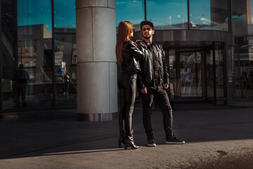 Gorgeous fashionable couple posing in the city
