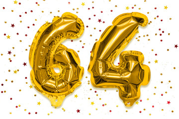 The number of the balloon made of golden foil, the number sixty four on a white background with multicolored sequins. Birthday greeting card with inscription 64. Numerical digit, Celebration event.