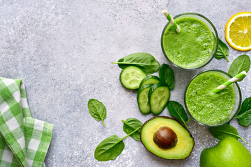 Detox smoothies from green vegetables ( cucumber, avocado, baby spinach and apple)  in a glasses....