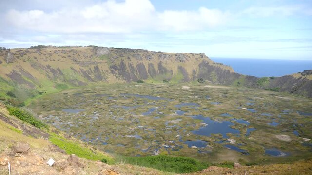 A large volcanic crater on Easter Island. Rano Kau crater. Orongo Crater from ridge in Easter Island, Chile. A crater on exotic volcanic island, Rapa Nui.