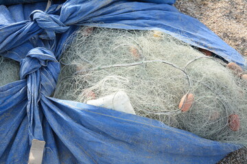 Fishing nets with buoys and ropes. Fishing nets ropes and floats on a harbor