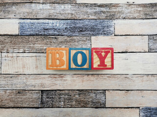 Boy. The word boy from wooden letter blocks. Fit for educational media, teaching, childrens book,...