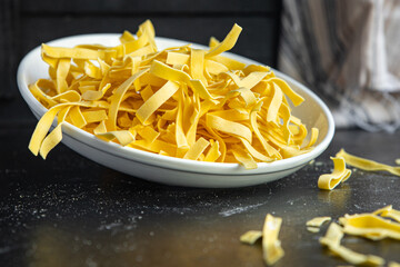 raw pasta egg tagliatelle handmade cooking durum wheat meal snack on the table copy space food background rustic 