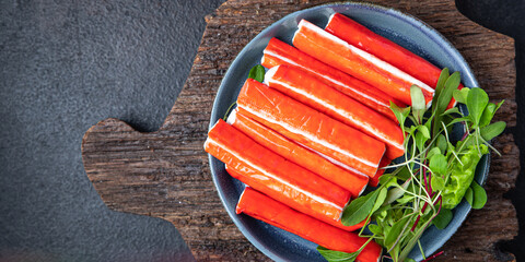 crab stick seafood semi-finished meal snack on the table copy space food background rustic  © Alesia Berlezova