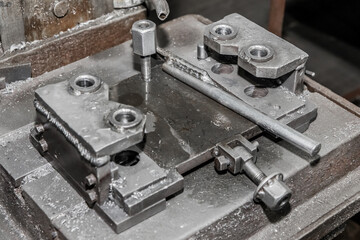 Process and system, equipment and tool for metalworking with fixing mechanisms for drilling iron with a tube for cooling water in the workshop of an industrial plant