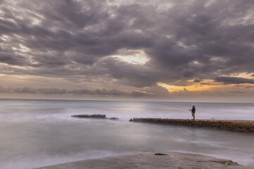 Pescador a la salida del sol