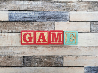 Game. The word game from wooden letter blocks. Fit for educational media, teaching, childrens book, etc