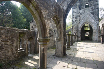 Fototapeta na wymiar Ruined old church at the historic small village of Heptonstall, Yorkshire. View of the interior of the historic old building. Landscape aspect view.