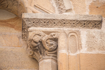 detail of a stone capital and part of the arch of a Romanesque church. Santa María de la oliva, Villaviciosa, Romanesque and pre-Romanesque of Asturias.