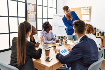 Group of business workers listening caucasian boss man conference at the office.